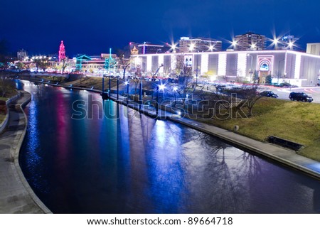 A view of the Kansas City Country Club Plaza Christmas lights and the skyline of downtown Kansas City, Missouri
