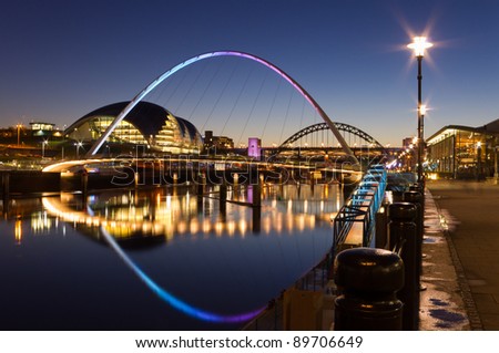 Newcastle quayside at night / Newcastle's quayside and bridges just after sundown showing the colourful lighting Royalty-Free Stock Photo #89706649