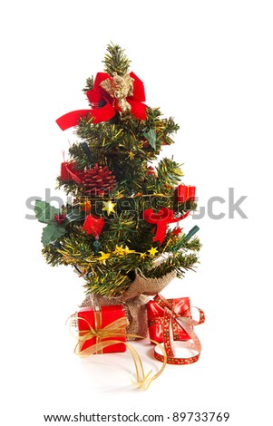 plastic christmas tree with red presents and decoration  isolated on white background