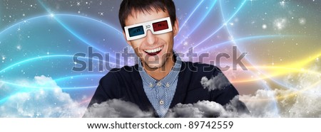 Portrait of young stylish modern man wearing 3d glasses watching 3d movie against cosmic futuristic background.