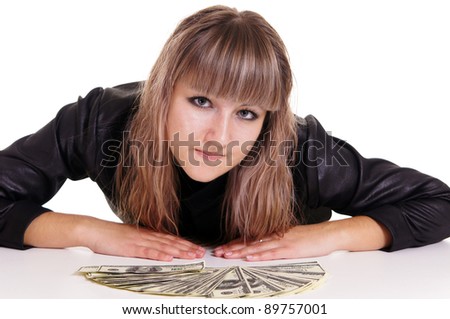 portrait of a cute girl with money at table