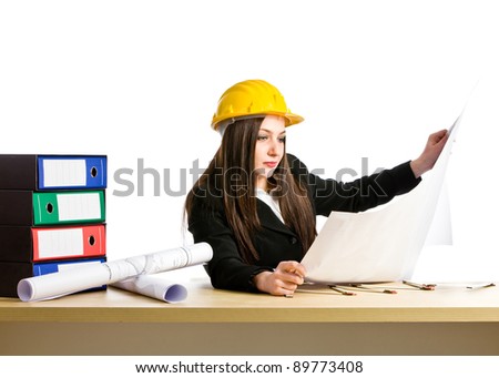 photo of young female architect with helmet and plans