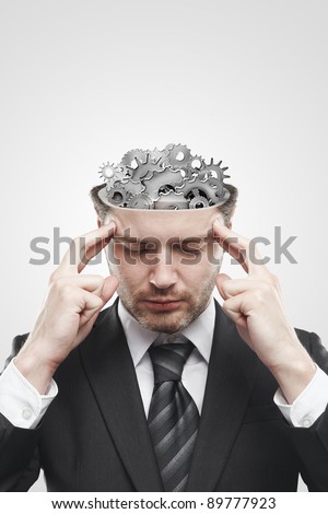 Open minded man with gears and cogs inside showing brain activity. Conceptual image of a open minded man Royalty-Free Stock Photo #89777923