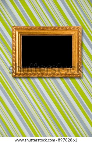 Gold frame on striped vintage wallpaper background