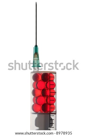 Red pills in a syringe. Close-up. Isolated on white.
