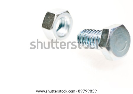 Bolt and nut extreme close up isolated over white background
