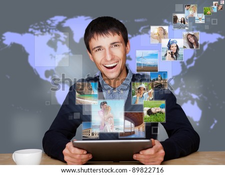 A technology man has images flying away from his modern tablet computer. Designed poster for a communication, social media sharing or tv concept.