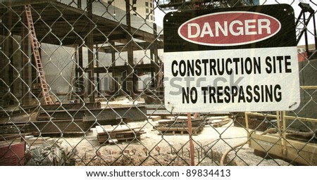  aged and worn vintage photo of danger construction site sign