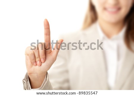 Photo of female hand with forefinger pointing upwards