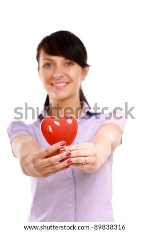Happy woman with red heart symbol isolated on white background
