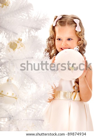 Child decorate white Christmas tree. Isolated.