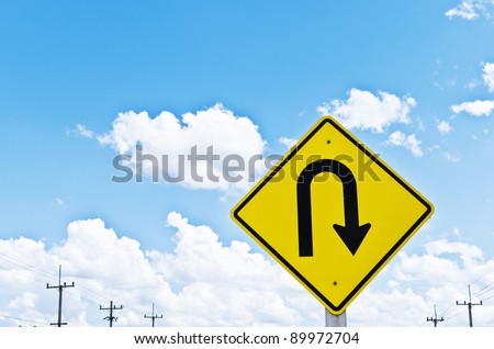 u-turn symbol and a beautiful blue sky