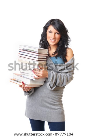 Portrait of beautiful young woman with stack of books on white background