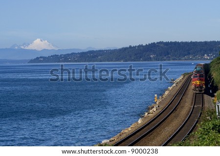 Train on Tracks By Pacific Ocean, Mount Baker Edmonds Washington Editor's Note--In response to comments from reviewer have further processed image to reduce noise and sharpen focus.