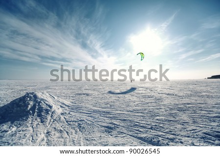 Ski kiting on a frozen lake Royalty-Free Stock Photo #90026545