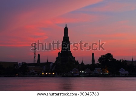 Wat Arun, The Temple of Dawn, at sunset,view across river. Bangkok, Thailand