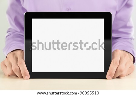 Businessman holding and showing black digital frame with blank screen.