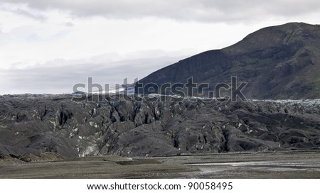 Glacier in Iceland, volcanic black ice