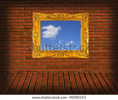 picture frames on brick wall
