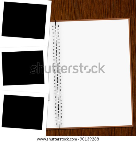 Blank notebook and photo on old wood background