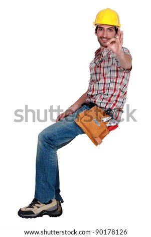 A male construction worker making an ok sign.