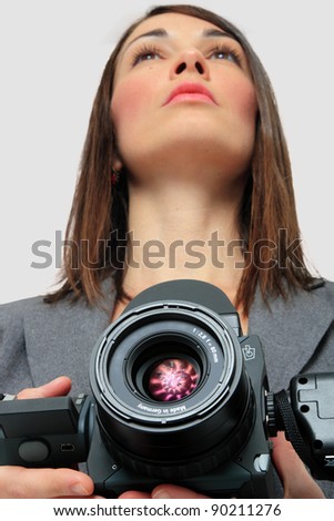 Woman in suit holding a Medium format Camera