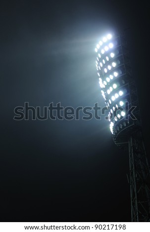 Stadium Lights against Dark Night Sky Background Royalty-Free Stock Photo #90217198