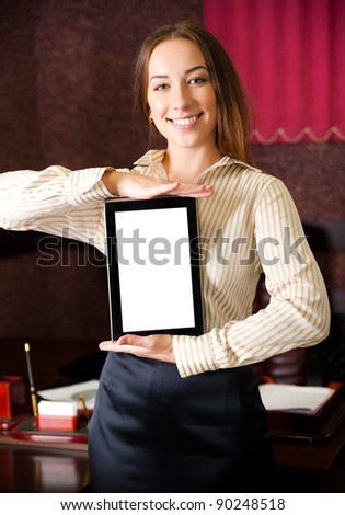 attractive young woman in the office with the tablet