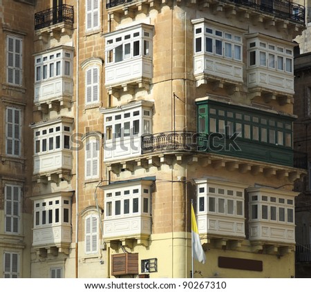 luxury mansions baroque style with the traditional balconies wooden in a Valletta street, Malta