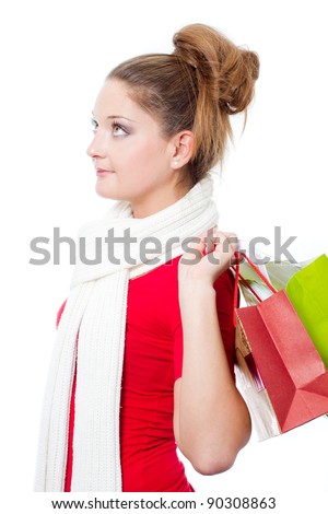young woman holding christmas gift bag - isolated on white background