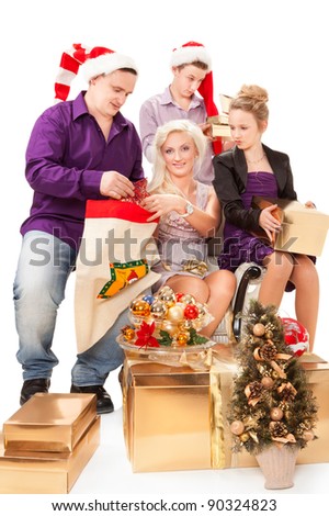 Young family having fun with Christmas presents.