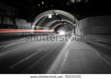 car lights trail in a tunnel in Malaga, Spain Royalty-Free Stock Photo #90333250