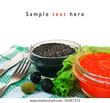 Black and red caviar, olives, greens. On white background.