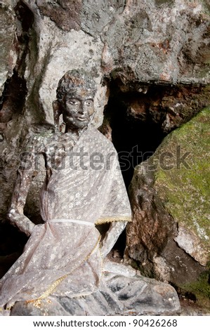 ancient buddha statue in cave temple yala, thailand