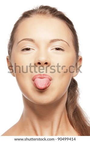bright closeup portrait picture of teenage girl sticking out her tongue