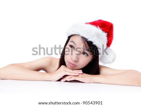 christmas young girl showing blank billboard banner sign and happy looking up direction. Beautiful and cute Asian female model