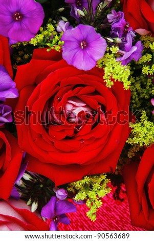 flowers : big bouquet of rose and pansy flowers with green grass in red wrapping paper