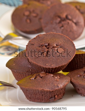 Chocolate muffin on fabric background.