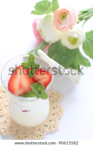 Cheese cake and strawberries in glass for spring dessert image