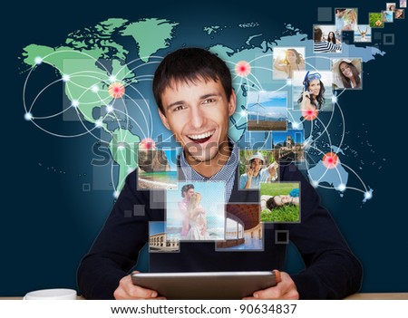 A technology man has images flying away from his modern tablet computer, He is at home. Designed poster for a communication, social media sharing or tv concept.