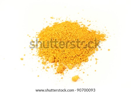 close up of a small portion of french ocher pigment isolated over white Royalty-Free Stock Photo #90700093