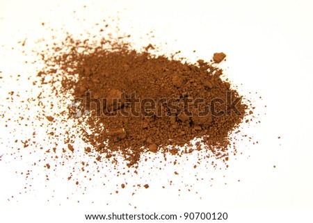 close up of a small portion of burnt umber pigment isolated over white Royalty-Free Stock Photo #90700120