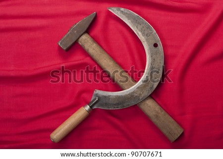 Hammer and sickle on a red flag background.