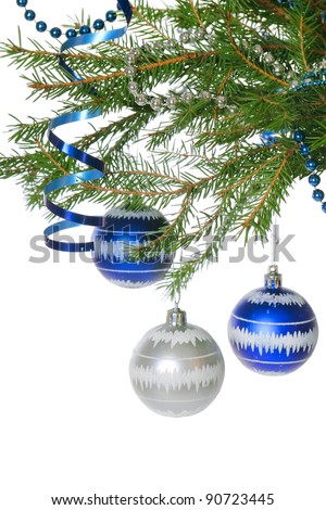 Fir branch with red christmas baubles on white background