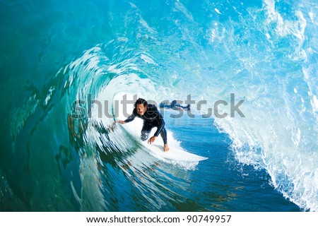 Surfer On Blue Ocean Wave Royalty-Free Stock Photo #90749957
