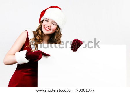 Female santa holding a christmas white card
