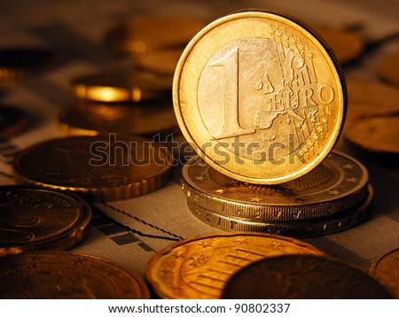 Euro coin on stock chart.