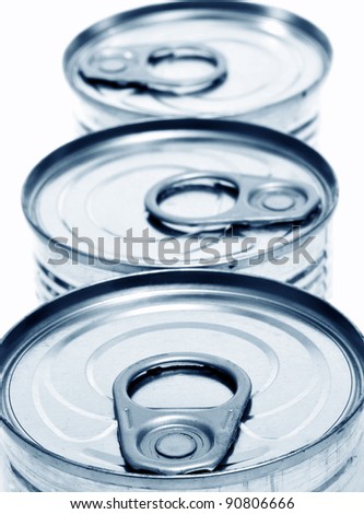 closeup of a pile of cans on a white background