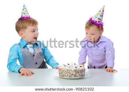 Beautiful little boy celebrates birthday. Isolated on white background