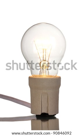 A lit light bulb isolated on white